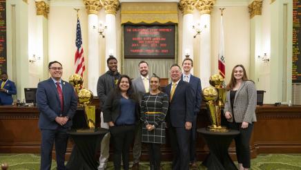 Warriors national championship trophy photos with Members and Staff in the Chamber