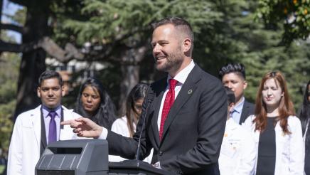 Photo of Asm. Haney and advocates speaking at AB371 Dental Coverage Press Conference
